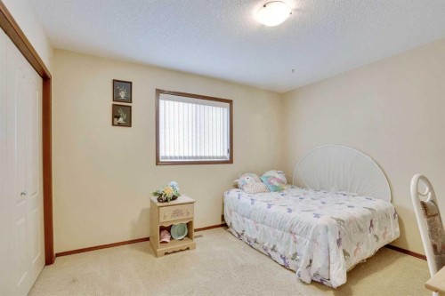 160 Tremblant Way Sw, Calgary, AB - Indoor Photo Showing Bedroom