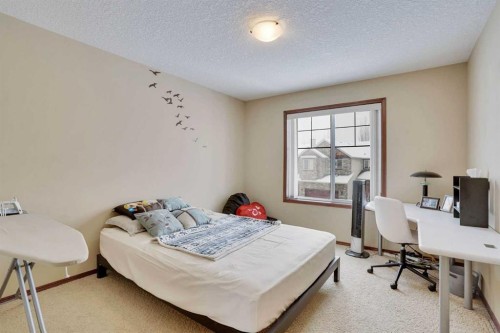 160 Tremblant Way Sw, Calgary, AB - Indoor Photo Showing Bedroom