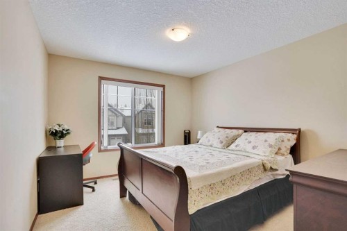 160 Tremblant Way Sw, Calgary, AB - Indoor Photo Showing Bedroom