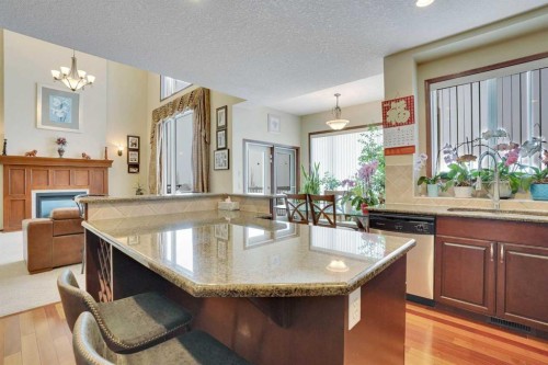 160 Tremblant Way Sw, Calgary, AB - Indoor With Fireplace