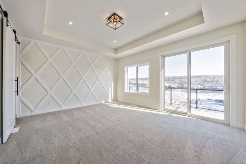 68 Sunvalley Way, Cochrane, AB - Indoor Photo Showing Other Room