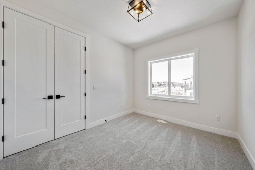 68 Sunvalley Way, Cochrane, AB - Indoor Photo Showing Other Room