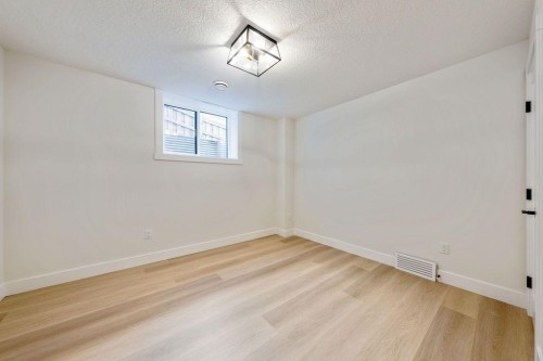 68 Sunvalley Way, Cochrane, AB - Indoor Photo Showing Other Room