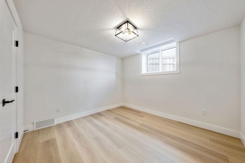 68 Sunvalley Way, Cochrane, AB - Indoor Photo Showing Other Room