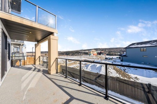 68 Sunvalley Way, Cochrane, AB - Outdoor With Exterior