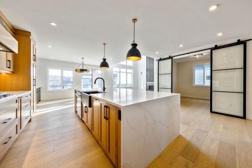 68 Sunvalley Way, Cochrane, AB - Indoor Photo Showing Kitchen With Upgraded Kitchen