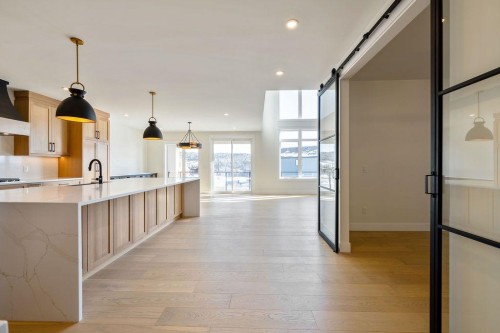 68 Sunvalley Way, Cochrane, AB - Indoor Photo Showing Kitchen With Upgraded Kitchen