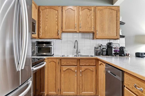 245 Millview Green Sw, Calgary, AB - Indoor Photo Showing Kitchen With Double Sink