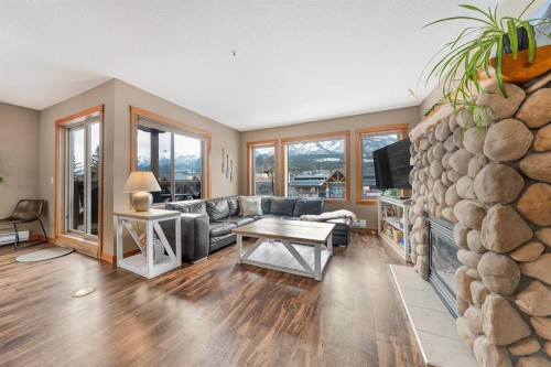 206C-1120 Railway Avenue, Canmore, AB - Indoor Photo Showing Living Room With Fireplace