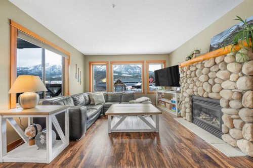 206C-1120 Railway Avenue, Canmore, AB - Indoor Photo Showing Living Room With Fireplace