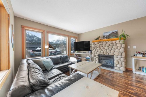206C-1120 Railway Avenue, Canmore, AB - Indoor Photo Showing Living Room With Fireplace