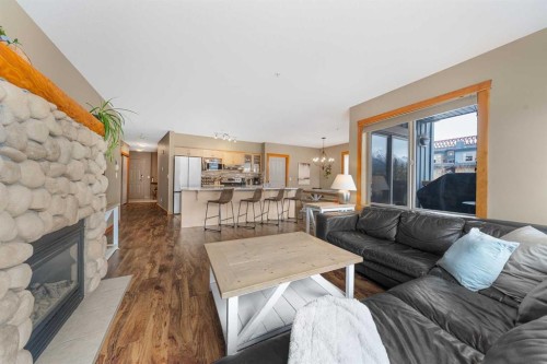 206C-1120 Railway Avenue, Canmore, AB - Indoor Photo Showing Living Room With Fireplace