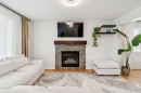 56 Silverado Plains View Sw, Calgary, AB  - Indoor Photo Showing Living Room With Fireplace 