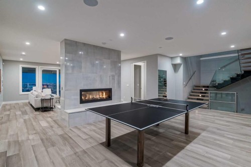 26 Patina Hill Sw, Calgary, AB - Indoor Photo Showing Other Room With Fireplace