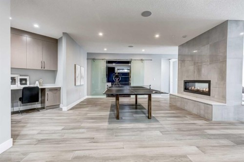 26 Patina Hill Sw, Calgary, AB - Indoor With Fireplace