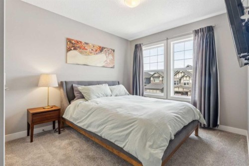 128 Sundown View, Cochrane, AB - Indoor Photo Showing Bedroom