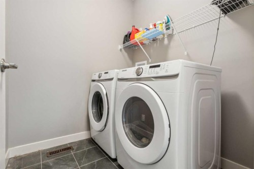 128 Sundown View, Cochrane, AB - Indoor Photo Showing Laundry Room