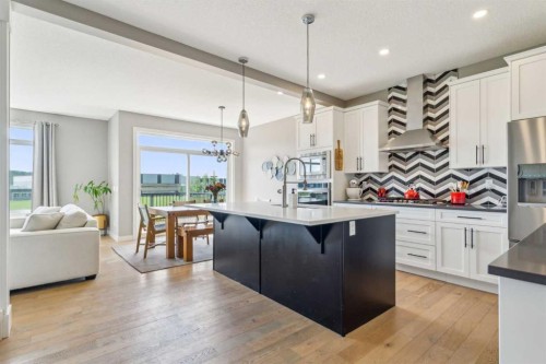 128 Sundown View, Cochrane, AB - Indoor Photo Showing Kitchen With Upgraded Kitchen