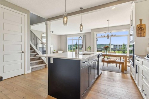 128 Sundown View, Cochrane, AB - Indoor Photo Showing Kitchen With Upgraded Kitchen