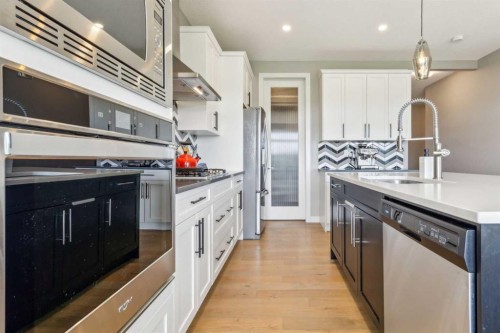 128 Sundown View, Cochrane, AB - Indoor Photo Showing Kitchen With Upgraded Kitchen