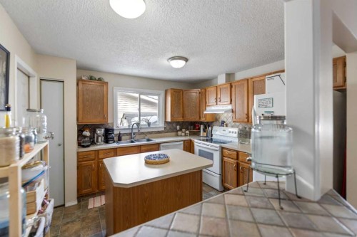 1607 Summerfield Boulevard, Airdrie, AB - Indoor Photo Showing Kitchen With Double Sink