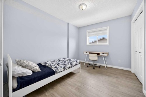 237 Willowbrook Close Nw, Airdrie, AB - Indoor Photo Showing Bedroom