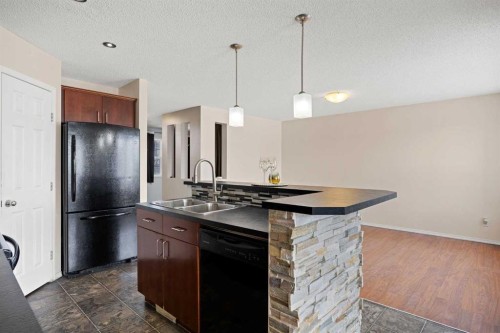 69 Everglen Way Sw, Calgary, AB - Indoor Photo Showing Kitchen With Double Sink