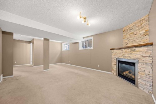 69 Everglen Way Sw, Calgary, AB - Indoor With Fireplace
