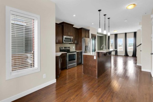 26 Willow Drive, Cochrane, AB - Indoor Photo Showing Kitchen With Upgraded Kitchen