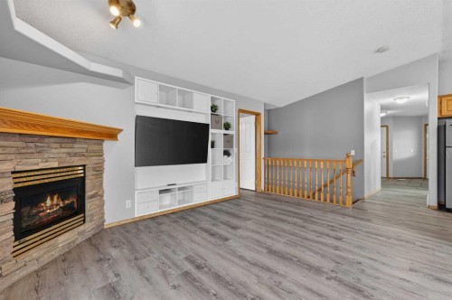 106 Cambridge Glen Drive, Strathmore, AB - Indoor Photo Showing Living Room With Fireplace
