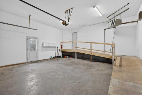 106 Cambridge Glen Drive, Strathmore, AB - Indoor Photo Showing Garage