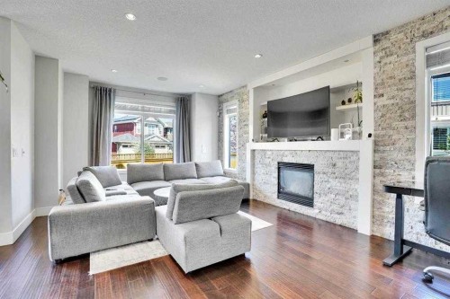 172 Kinniburgh Way, Chestermere, AB - Indoor Photo Showing Living Room With Fireplace