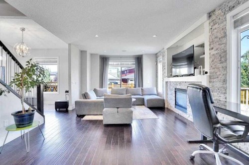172 Kinniburgh Way, Chestermere, AB - Indoor Photo Showing Living Room With Fireplace