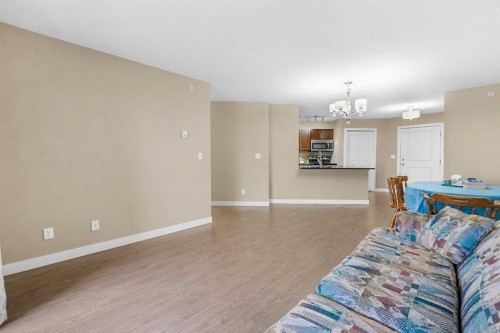 409-5 Saddlestone Way Ne, Calgary, AB - Indoor Photo Showing Living Room