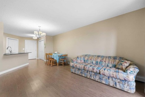 409-5 Saddlestone Way Ne, Calgary, AB - Indoor Photo Showing Living Room