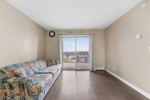 409-5 Saddlestone Way Ne, Calgary, AB - Indoor Photo Showing Living Room