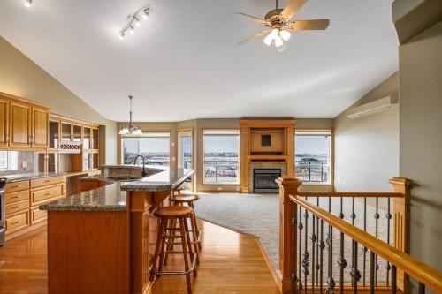 20 Hillcrest Boulevard, Strathmore, AB - Indoor Photo Showing Kitchen With Fireplace