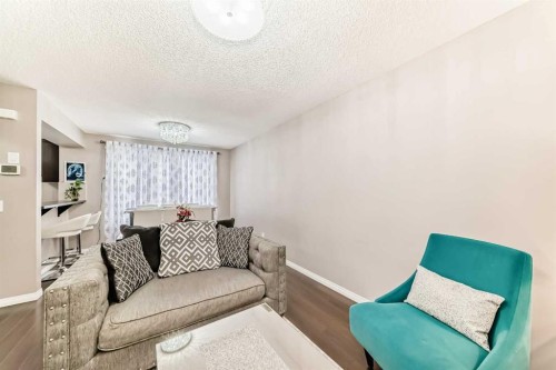 127 Windford Gardens Sw, Airdrie, AB - Indoor Photo Showing Living Room