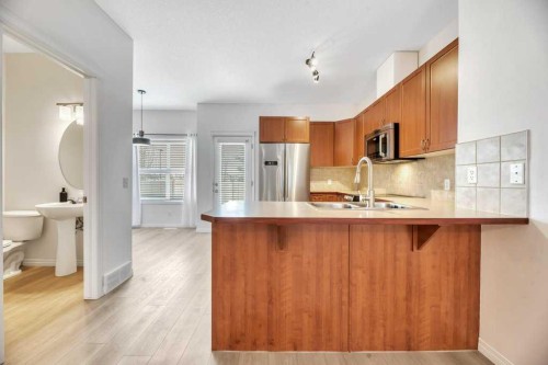 109 Ranch Ridge Meadow, Strathmore, AB - Indoor Photo Showing Kitchen With Double Sink