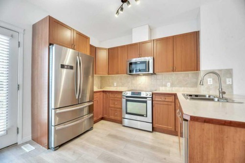 109 Ranch Ridge Meadow, Strathmore, AB - Indoor Photo Showing Kitchen With Double Sink