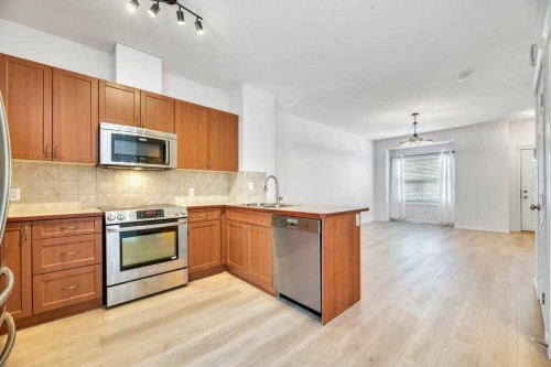 109 Ranch Ridge Meadow, Strathmore, AB - Indoor Photo Showing Kitchen With Double Sink