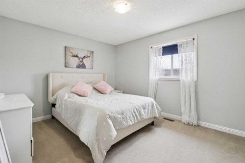 54 Chapala Grove Se, Calgary, AB - Indoor Photo Showing Bedroom