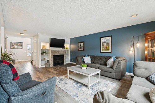 54 Chapala Grove Se, Calgary, AB - Indoor Photo Showing Living Room With Fireplace