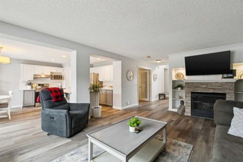 54 Chapala Grove Se, Calgary, AB - Indoor Photo Showing Living Room With Fireplace
