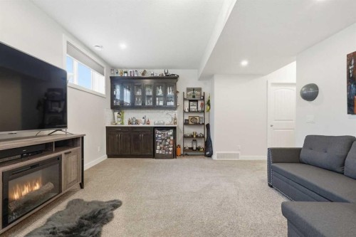 99 Valarosa Drive, Didsbury, AB - Indoor Photo Showing Living Room With Fireplace