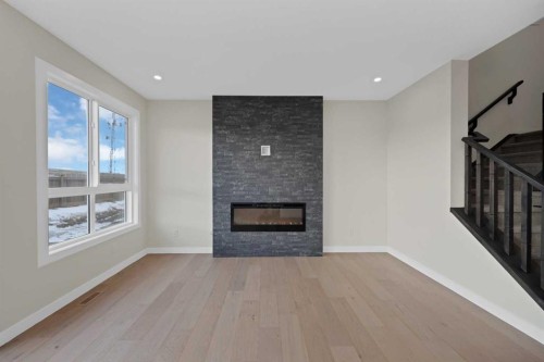 191 Homestead Common Ne, Calgary, AB - Indoor Photo Showing Living Room With Fireplace