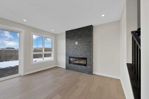 191 Homestead Common Ne, Calgary, AB - Indoor Photo Showing Living Room With Fireplace