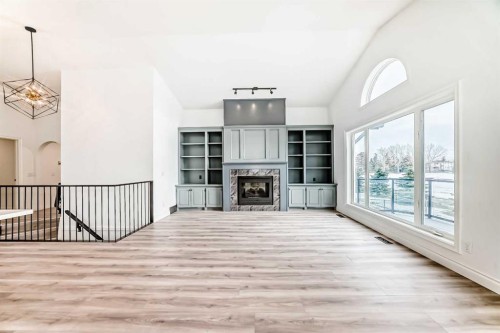 228 Woodside Crescent Nw, Airdrie, AB - Indoor Photo Showing Other Room With Fireplace