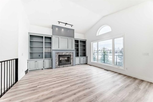 228 Woodside Crescent Nw, Airdrie, AB - Indoor With Fireplace