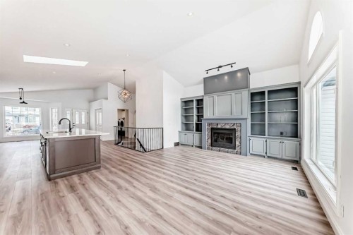 228 Woodside Crescent Nw, Airdrie, AB - Indoor With Fireplace